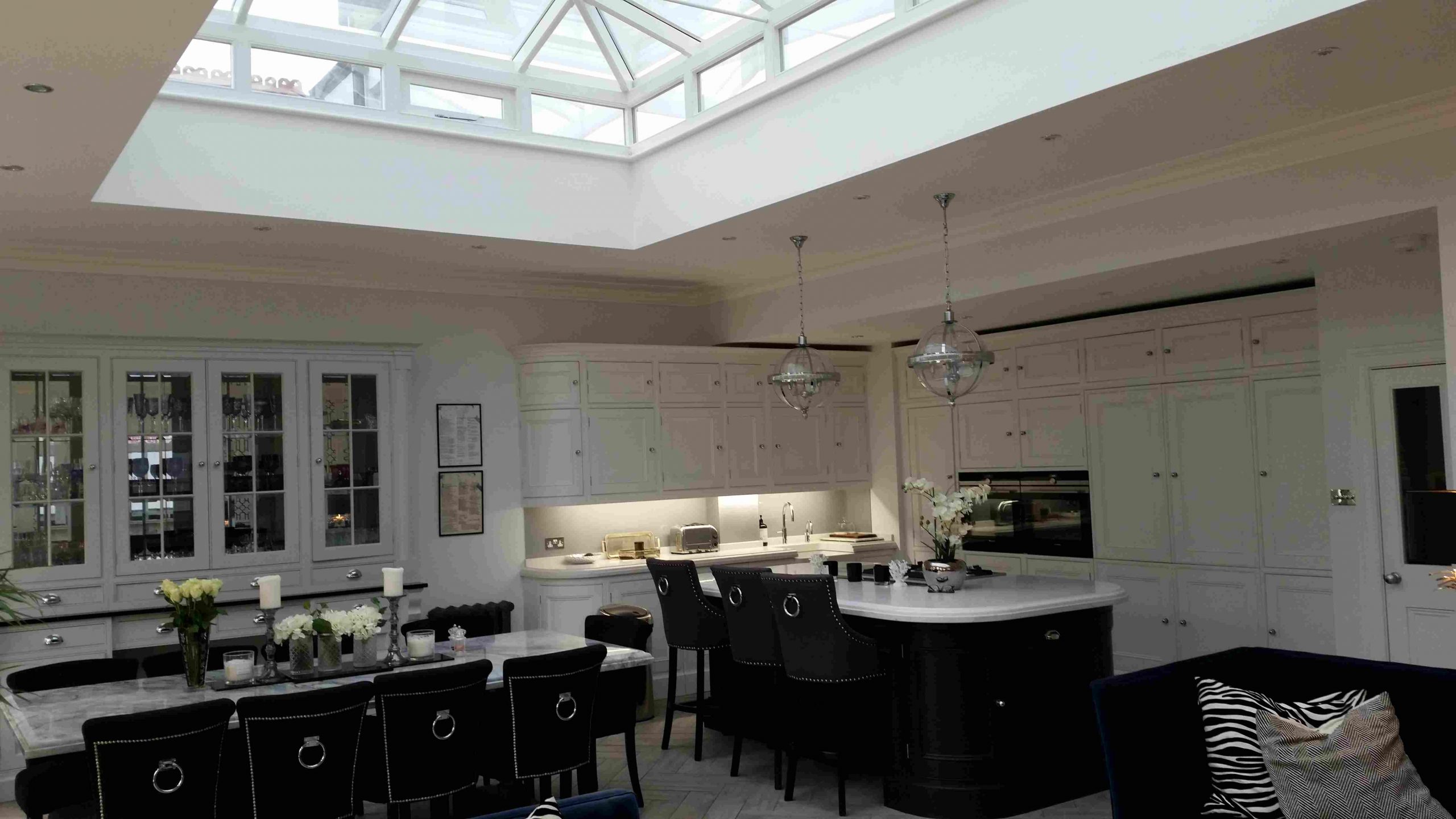A large modern kitchen with skylight