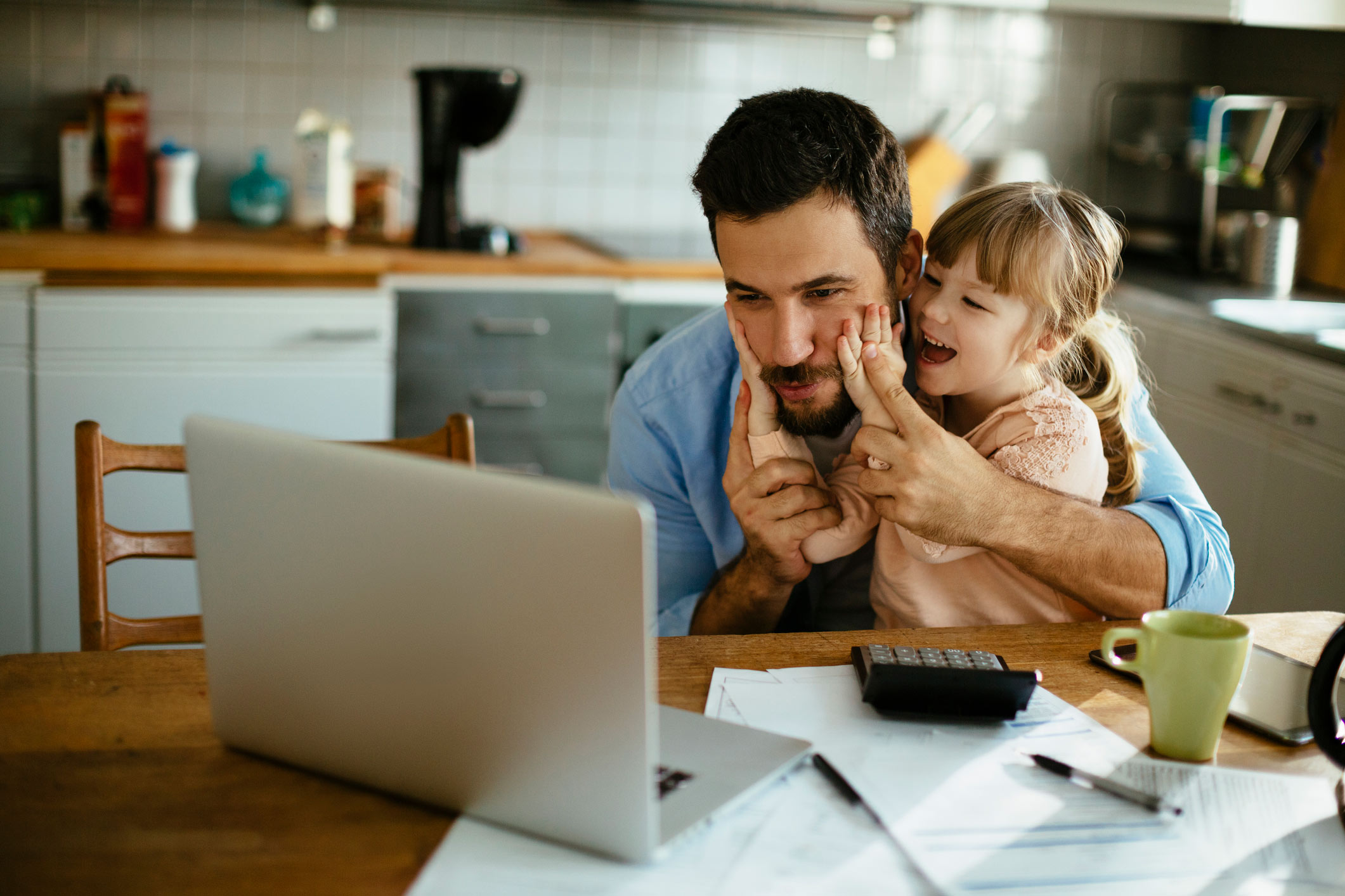 Man and daughter looking at kitchen finance options